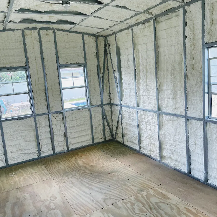 Closed-cell spray foam insulation applied to wall cavities in a residential project in Aztec